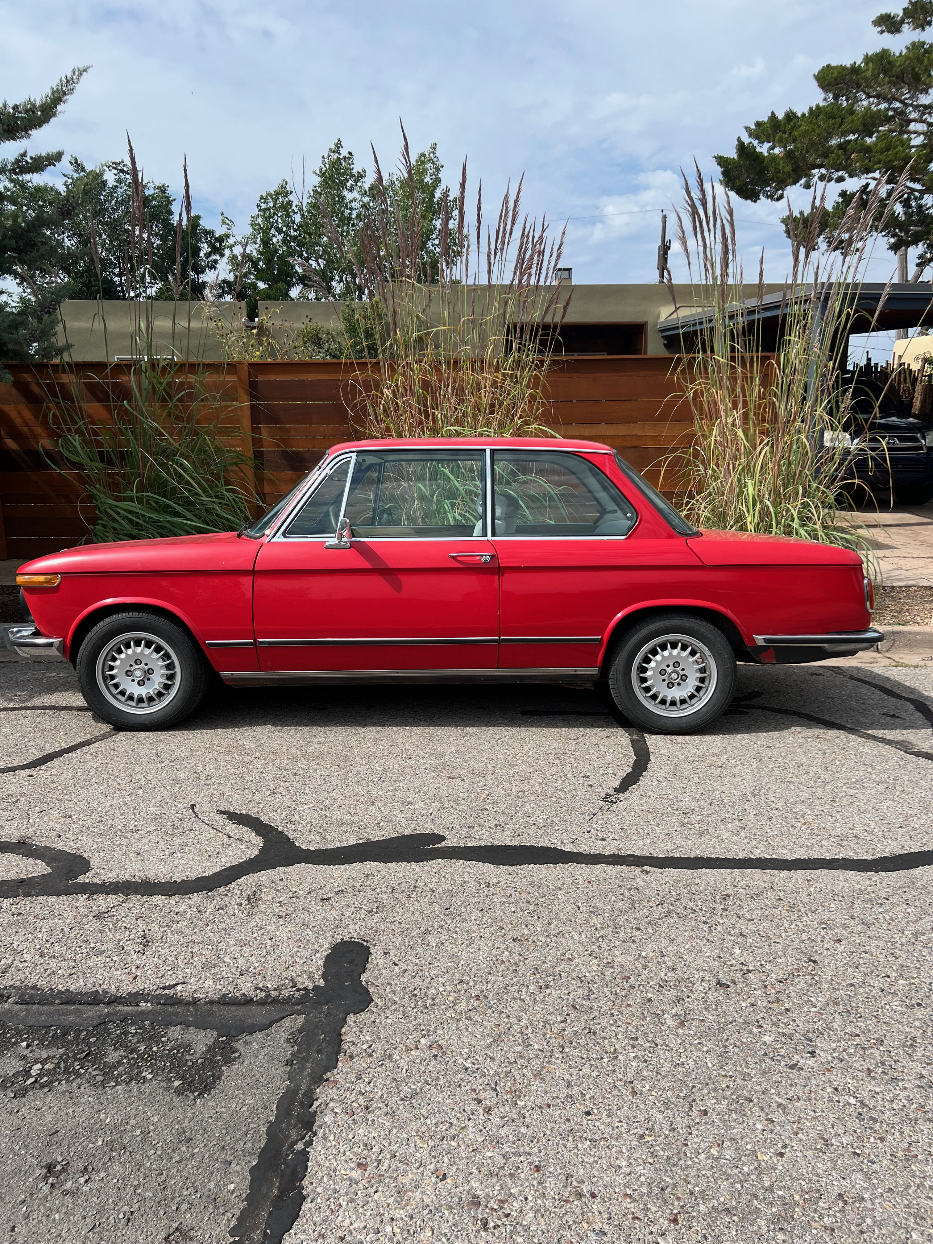 1974 BMW 2002tii — Verona Red on street, Santa Fe