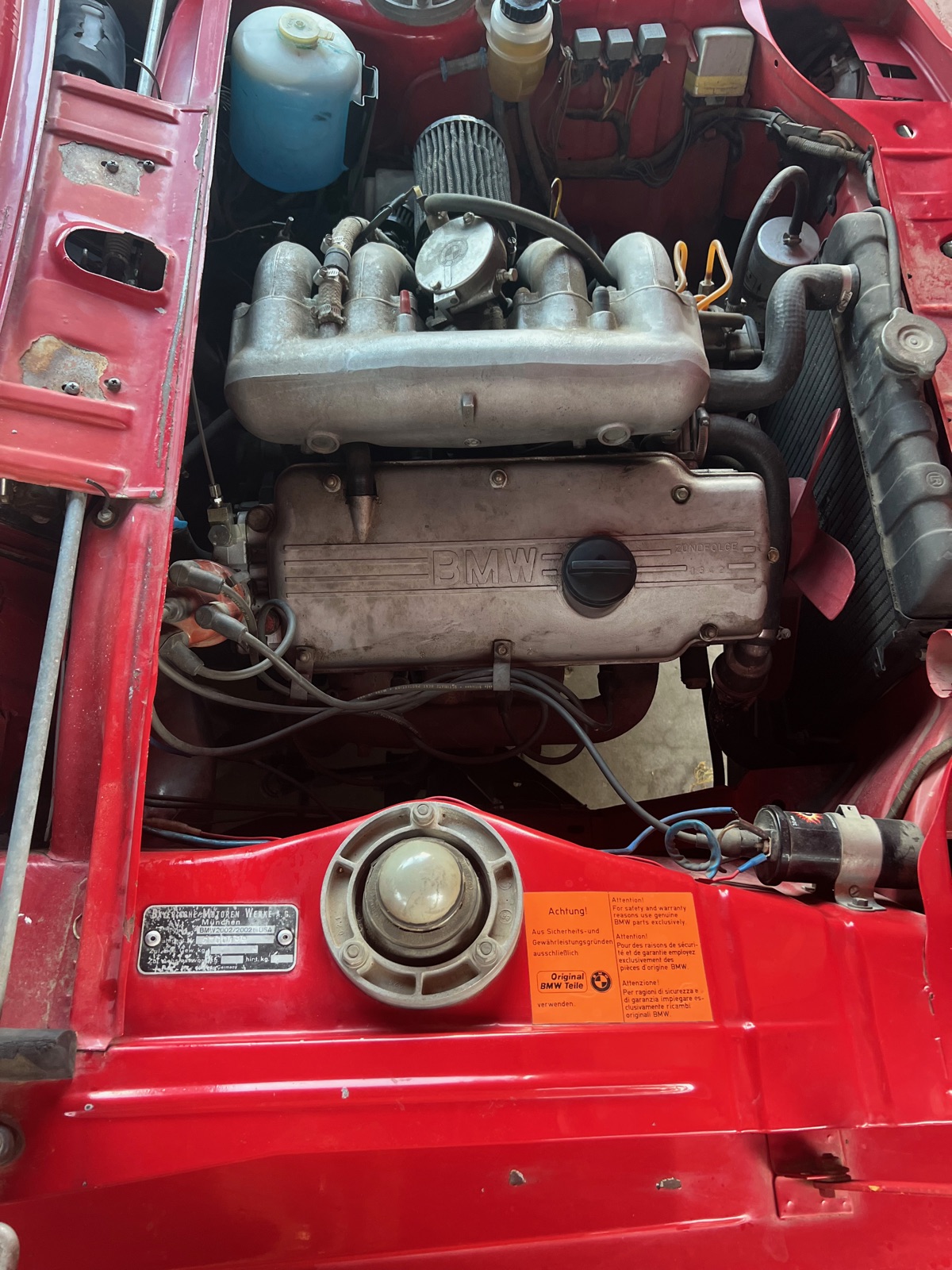 BMW 2002 engine bay reassembled — valve cover on, Original BMW Teile sticker visible
