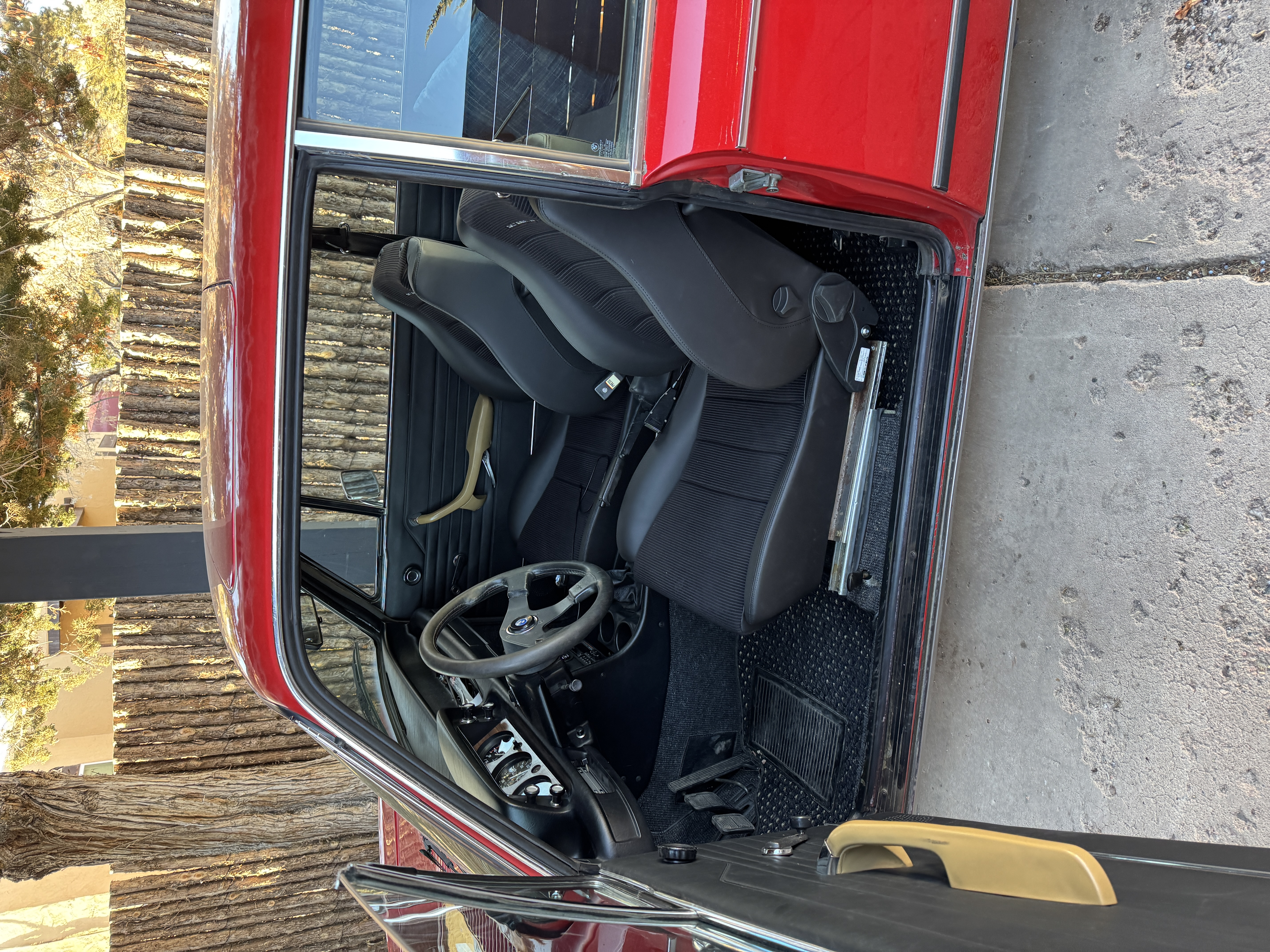 BMW 2002 interior — black sport seats, steering wheel, restored cabin