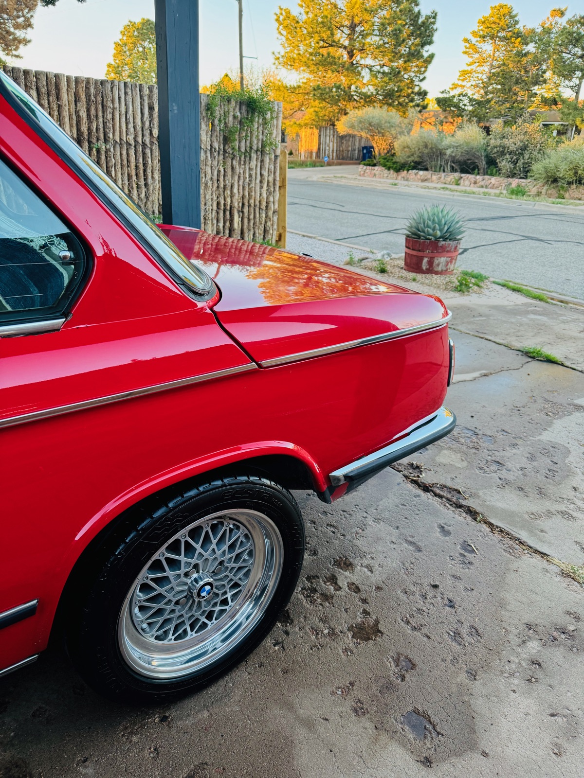 BMW 2002 rear quarter detail — BBS wheels, golden hour light