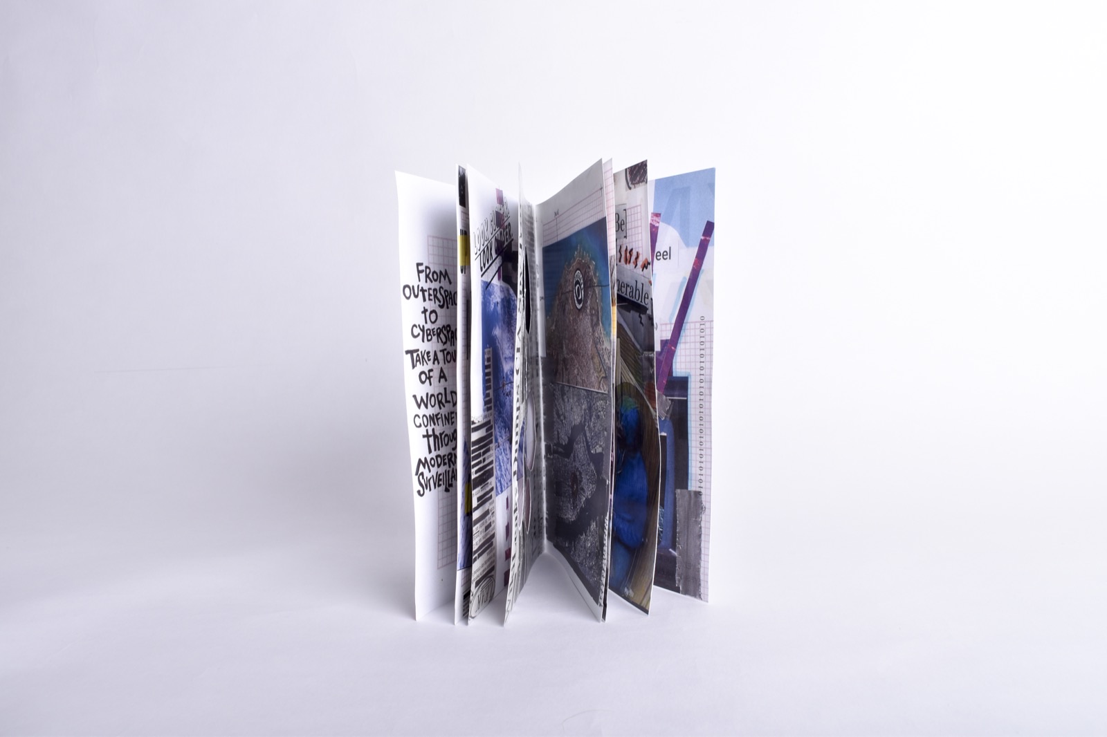 All Eyes On Us — zine fanned open showing all pages standing